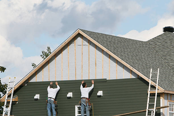 Professional Storm Damage Siding Repair technician working in Liberty, IN